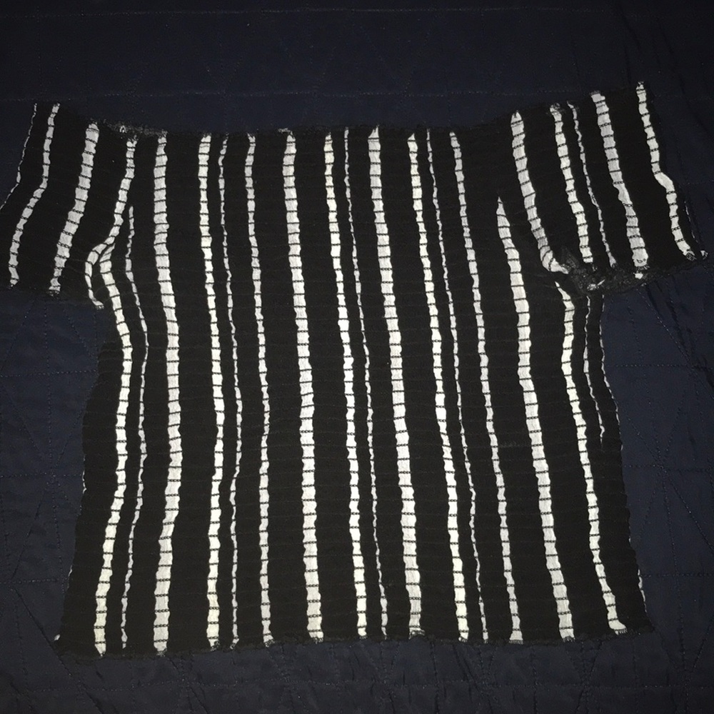 A black and white strip off the shoulder shirt